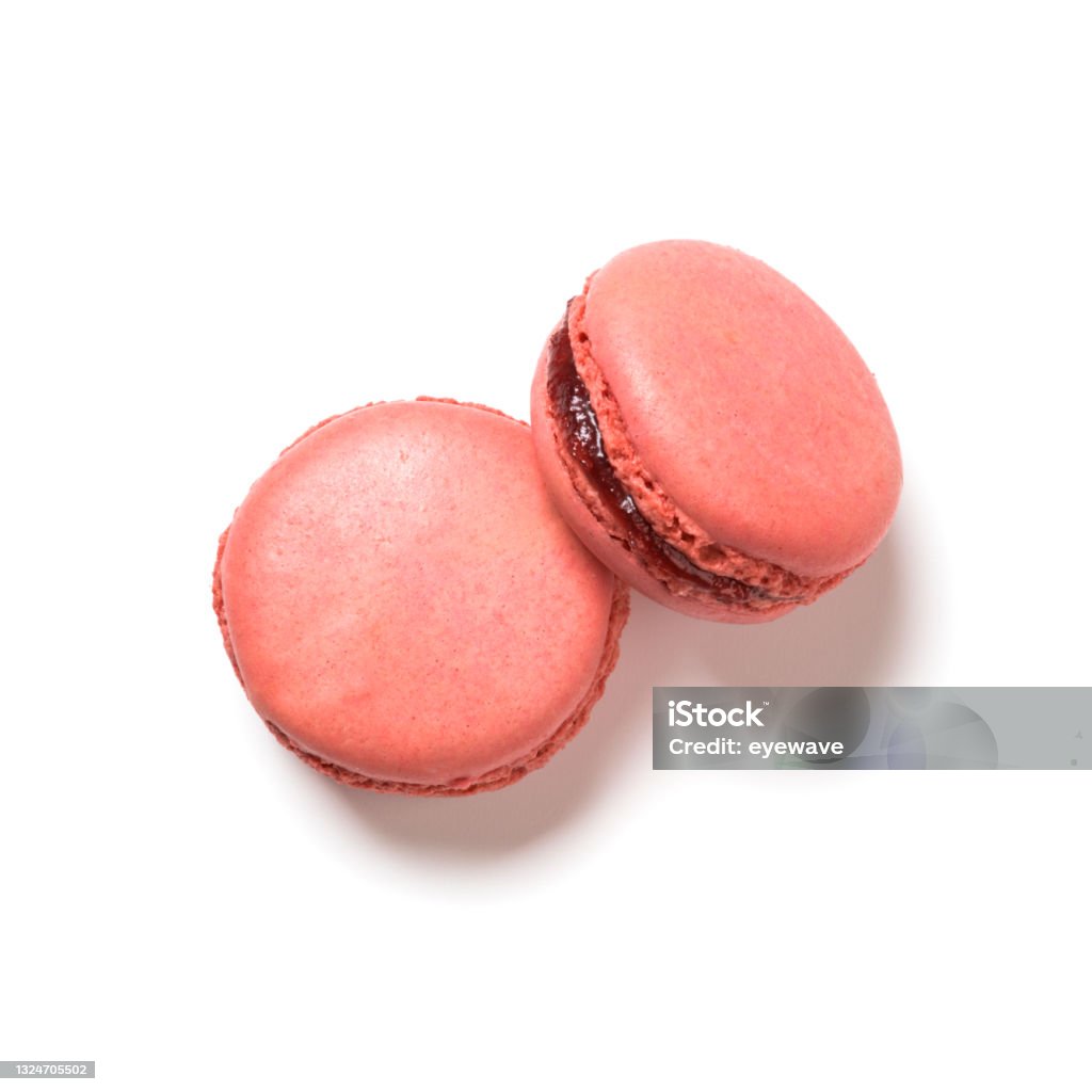 Raspberry flavor macarons top view isolated on white Raspberry flavor macarons top view isolated on white background Macaroon Stock Photo