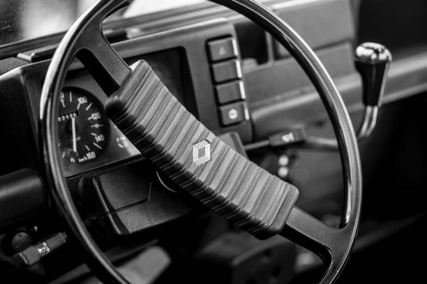 Hamburg, Germany - June 20. 2021: Close up of oldtimer car Renault r4 steering wheel and gear shift, parked in Hamburg, Germany