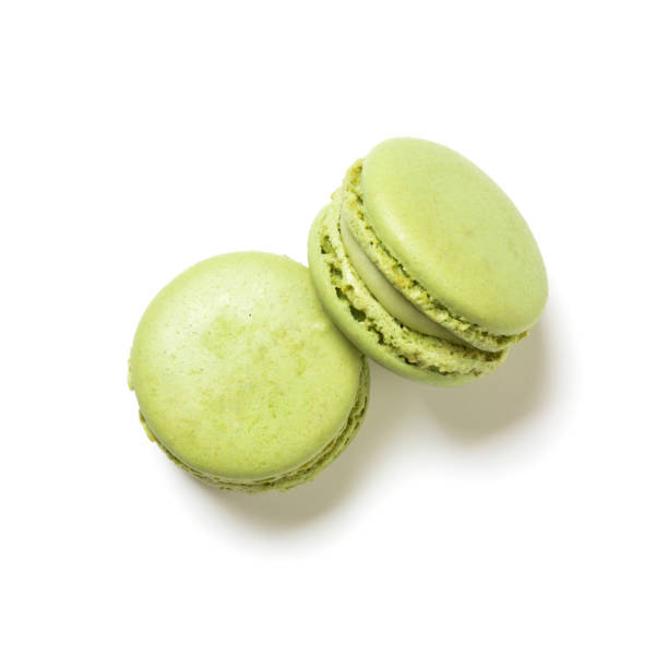 istock Pistachio flavor macarons top view isolated on white 1324705527