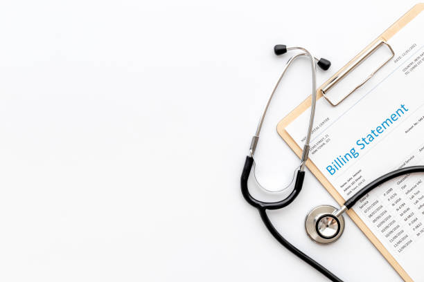 Medical billing statement with stethoscope. Top view