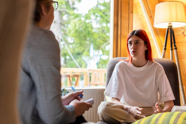 istock A young woman in a session with a psychologist 1324706635