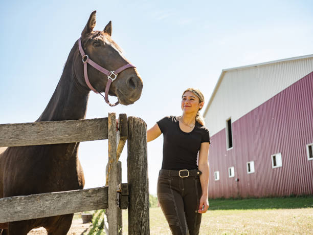 istock Young female trainer with her horse 1324706753