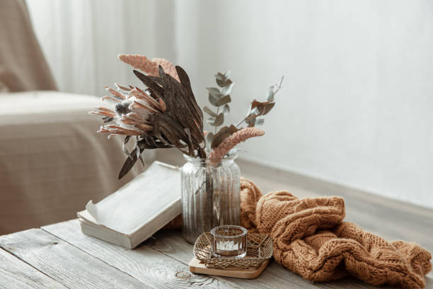 Cozy home still life with a book and decorative elements.