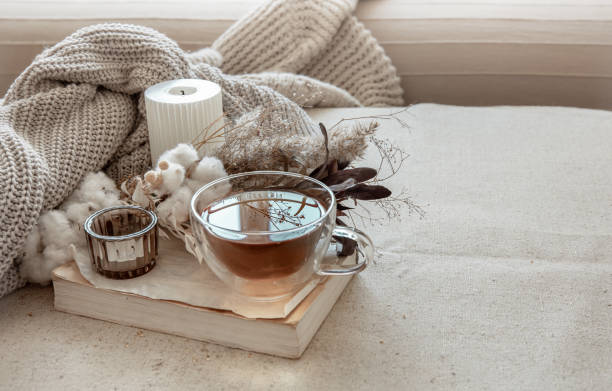 istock Cozy composition with tea, dried flowers and home decor details. 1324707659