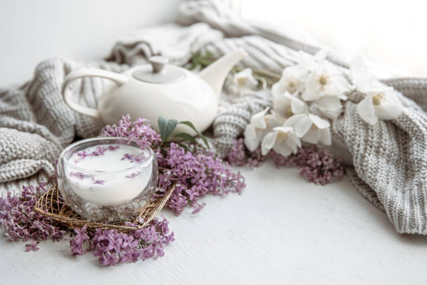 istock Spring home still life with a cup of milk and spring flowers copy space. 1324708434