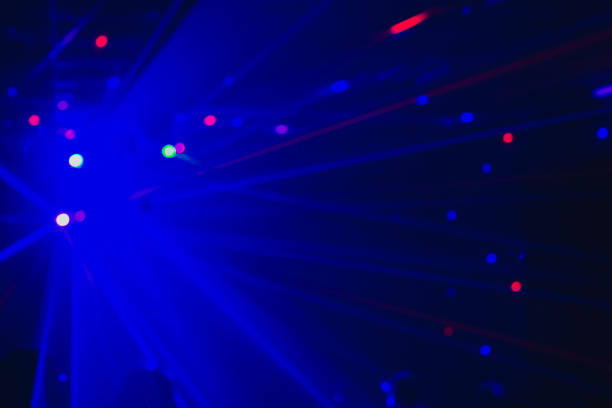 istock Blurry background with laser blue lights of a disco, dance floor 1324708626