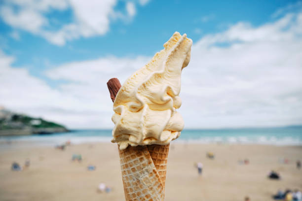 istock Ice Cream Cone above Towan Beach, Newquay, Cornwall on a June day. 1324708684