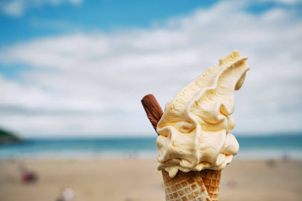 istock Ice Cream Cone above Towan Beach, Newquay, Cornwall on a June day. 1324708713