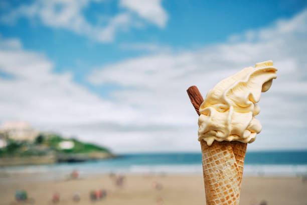 istock Ice Cream Cone above Towan Beach, Newquay, Cornwall on a June day. 1324708721