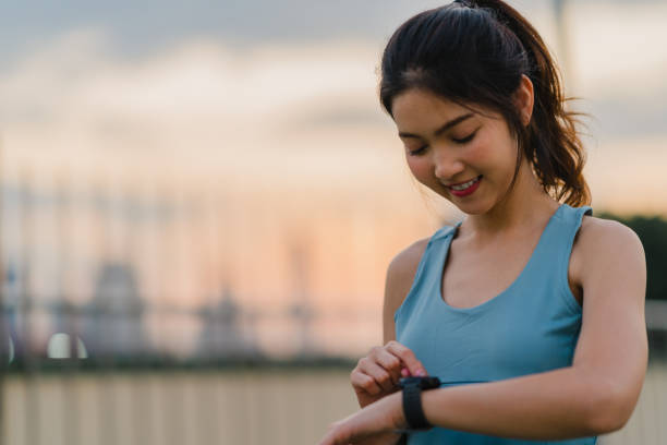 istock Beautiful young Asia athlete lady exercises doing stretch work out in urban environment. Japanese teen girl wearing sports clothes on walkway bridge in early morning. Lifestyle active sporty in city. 1324709382
