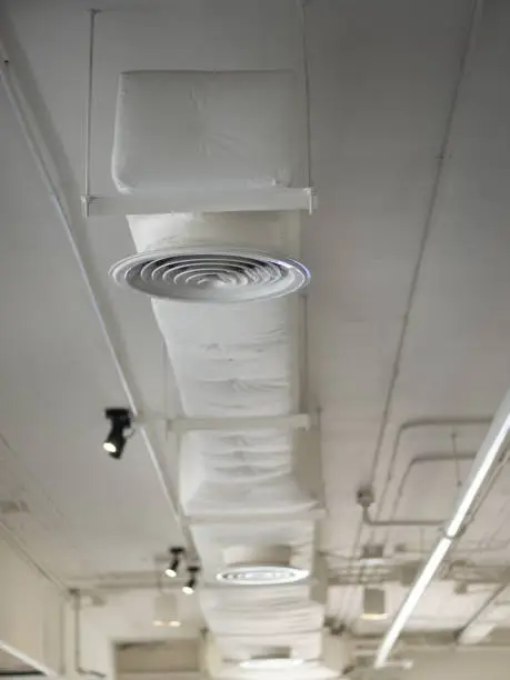 Photo of Air Ventilating tube installed on the ceiling of the office building or mall.