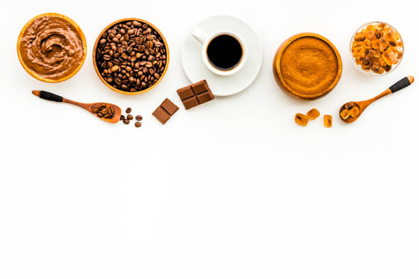 istock Espresso in white cup and coffee beans, top view. Coffee background 1324710792