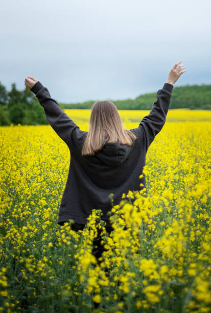 istock Young girl on yellow rapeseed field 1324711252