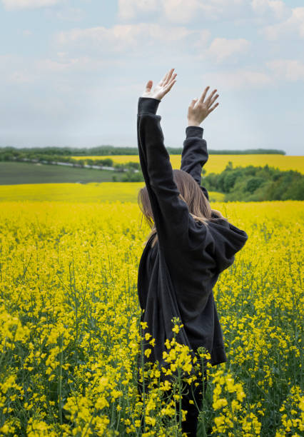 istock Young girl on yellow rapeseed field 1324711263