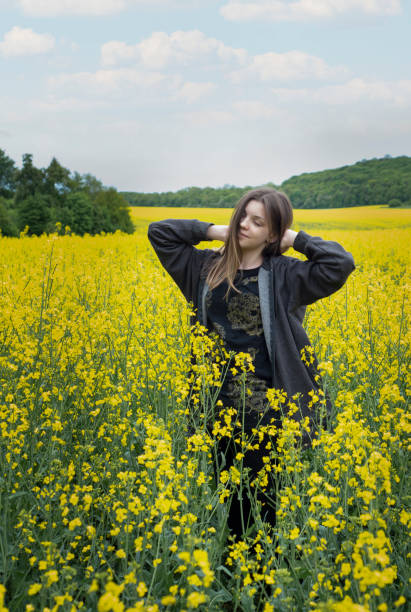 istock Young girl on yellow rapeseed field 1324711285