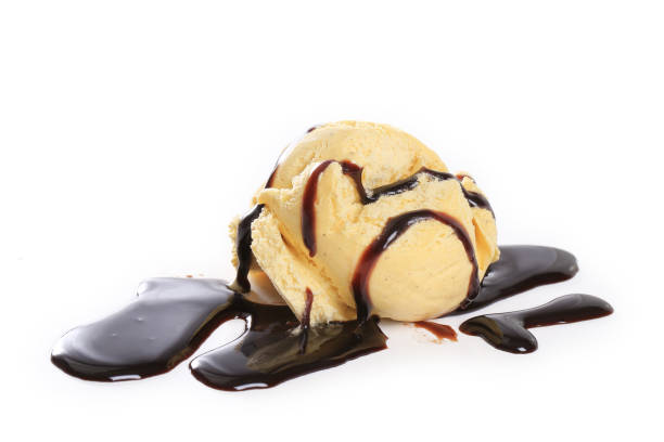 istock vanilla ice cream, ice cream with a chocolate coulis isolated on white background 1324712809