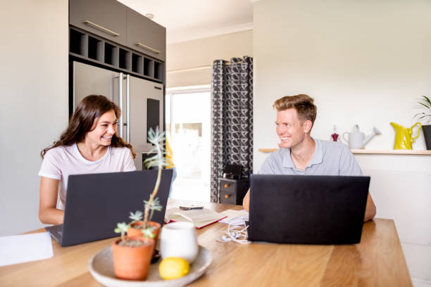 istock Friends using laptop and studying at home 1324713562
