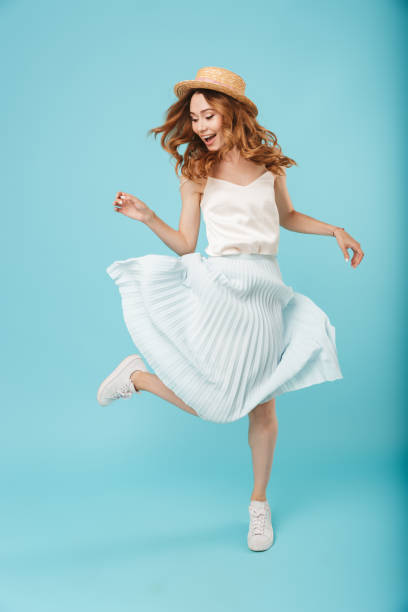 istock Emotional caucasian woman jumping 1324714349