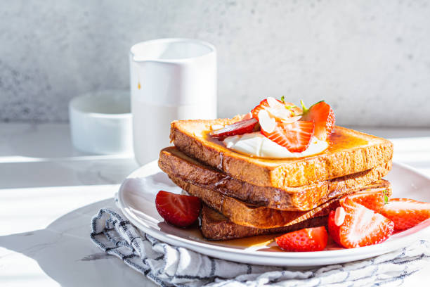 istock A stack of French toast with strawberries, yogurt and maple syrup. Breakfast concept. 1324717357