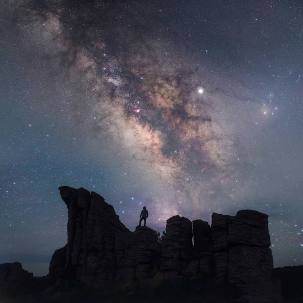 istock Explore the stone forest under the Milky Way sky 1324718463