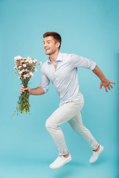 istock Happy caucasian man running isolated 1324718947