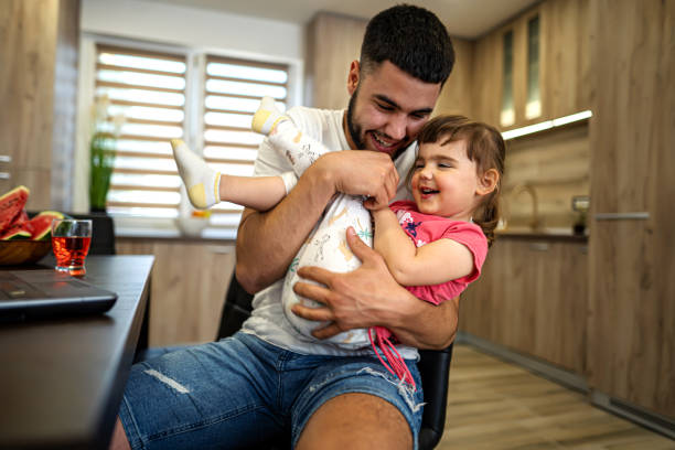 istock Young man have fun with his little daughter 1324722115