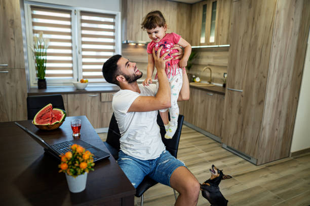 Young man have fun with his little daughter