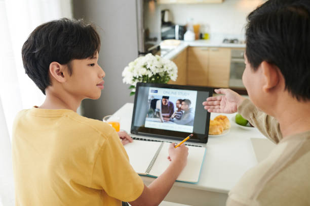 istock Teenage Boy Watching Online Webinar 1324724218