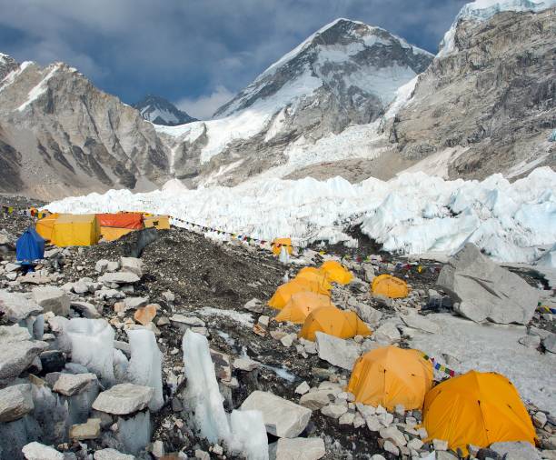 istock Mount Everest base camp yellow tents and prayer flags 1324724356