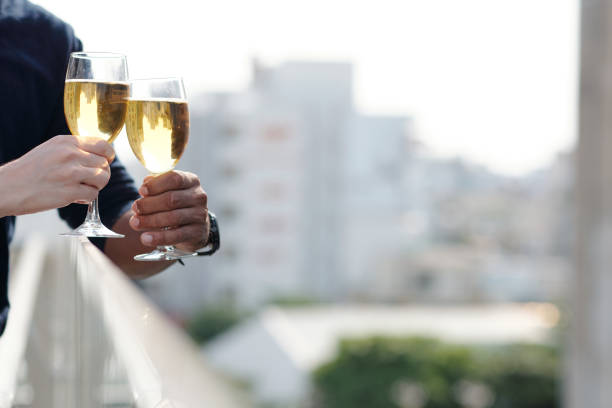 istock Hands of Couple Drinking Wine 1324725848