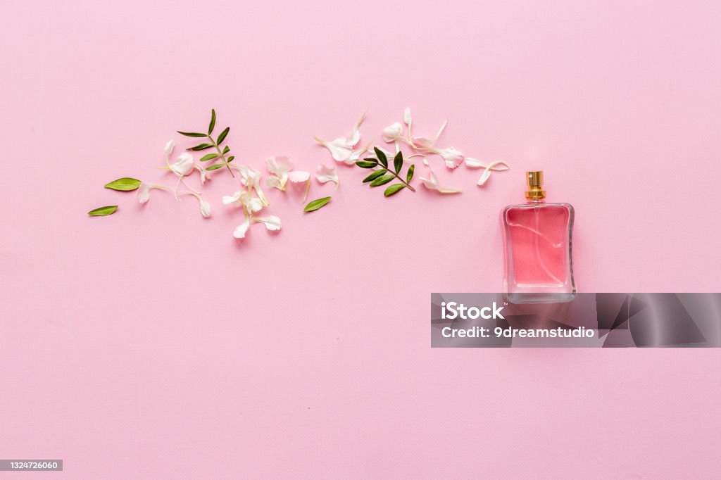 Perfume bottle flat lay with fragrance ingredients, top view Perfume bottle flat lay with fragrance ingredients, top view. Perfume Stock Photo