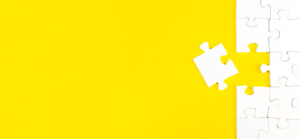 istock jigsaw puzzle with one piece left on yellow background 1324728242