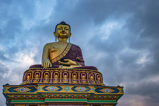istock huge buddha golden statue from different perspective with moody sky at evening 1324731368