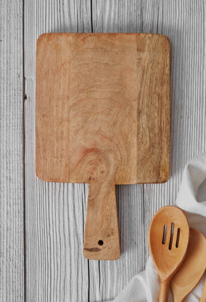 istock Wooden cutting board and cooking utensils 1324733186