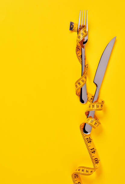 istock Tape measure on a fork and a knife 1324733240