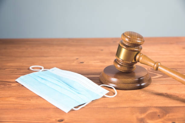 istock judicial gavel with a medical mask on the table 1324734476