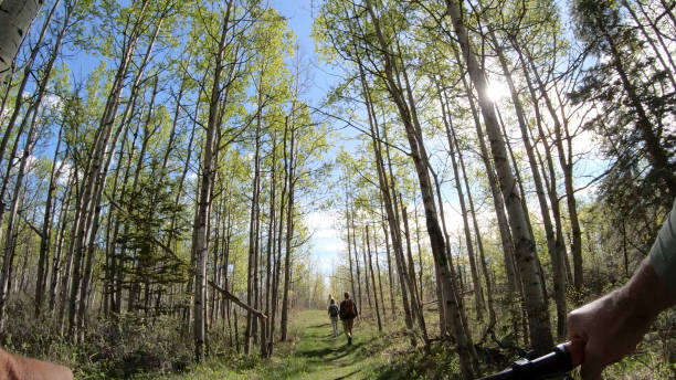 Friend on mountain bike catches up with them