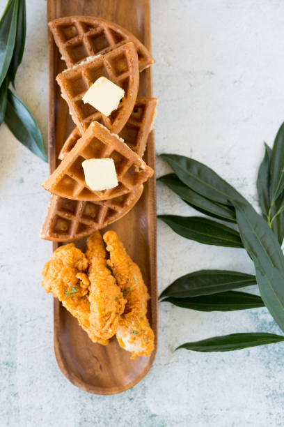 istock Gourmet Chicken and Waffles Plated Restaurant Style with Side of Syrup in Silver Pitcher 1324737202