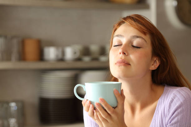 istock Woman relaxing drinking coffee in the kitchen 1324738110