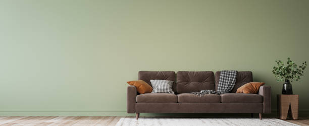 istock Simple minimal modern style interior, brown sofa on green wall background 1324739720