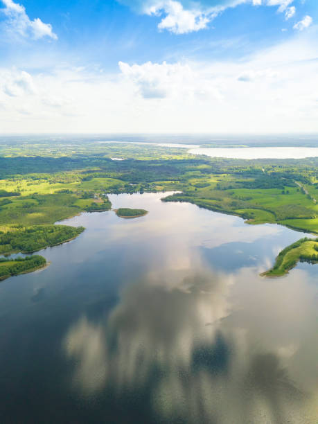 Beautiful landscape on the Braslav Lakes from a drone on a sunny day with a sky with clouds, Belarus. Vertical photo Beautiful landscape on the Braslav Lakes from a drone on a sunny day with a sky with clouds, Belarus. Vertical photo braslav lakes stock pictures, royalty-free photos & images