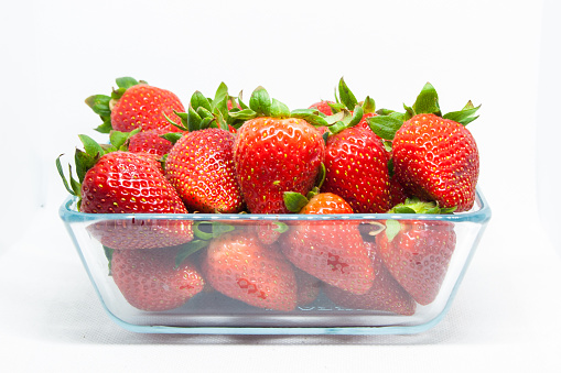 Photograph of strawberries on a white background