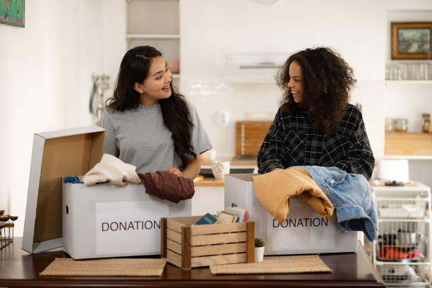istock Two young women preparing donations for charity 1324745847