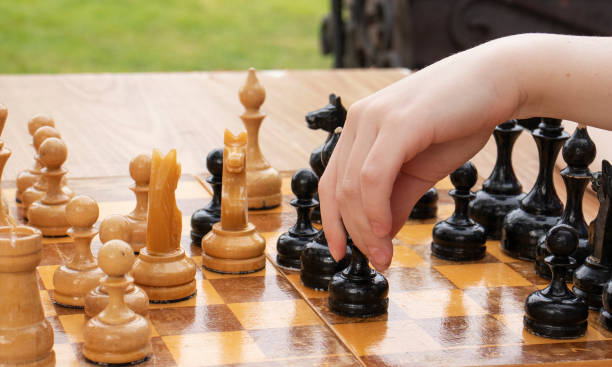 istock playing chess in the village 1324746399