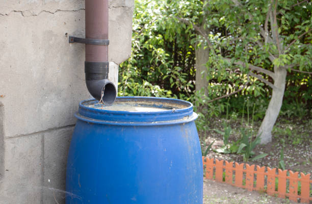 istock blue barrel with rainwater in the country 1324746536
