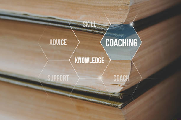 istock coaching and training concept on the background of a stack of books 1324747010