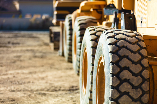 Tires and Tread Excavator Dump Truck and Grader Heavy Machinery Construction Zone Work Western USA Photo Series Matching 4K Video Available (Shot with Canon 5DS 50.6mp photos professionally retouched - Lightroom / Photoshop - original size 5792 x 8688 downsampled as needed for clarity and select focus used for dramatic effect) Matching 4K Video Available