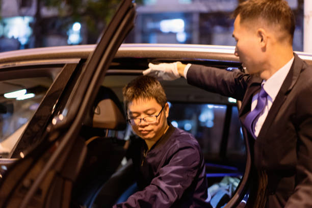 istock Professional male driver protects passengers from getting off the bus 1324747224