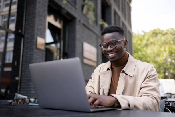 istock Young African American male freelancer working on a laptop 1324748055