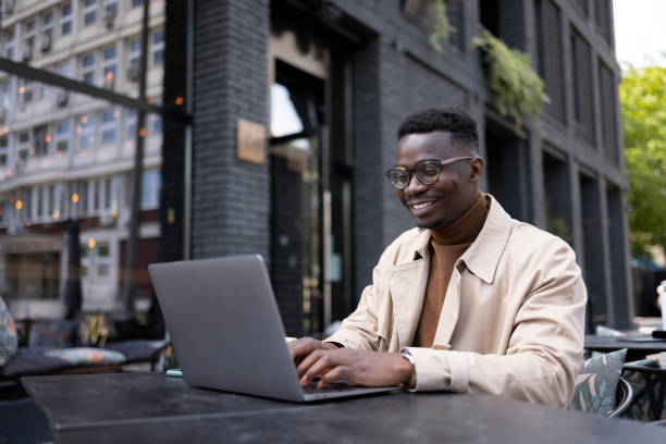 istock Young African American male freelancer working on a laptop 1324748057